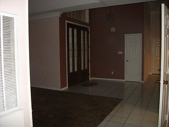 As you enter the front door you see the lake