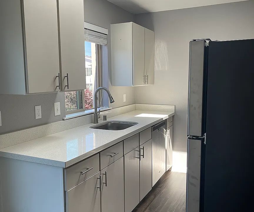 Quartz kitchen with stainless appliances