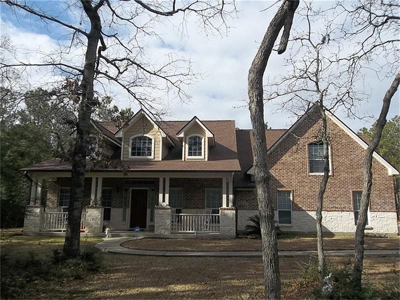 View of the front of the home from the clearing near the street