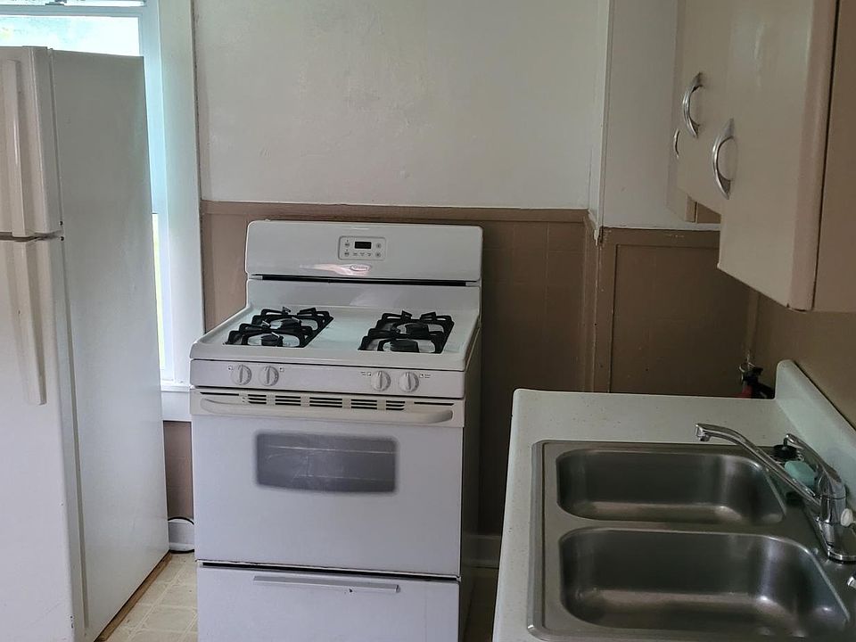 Kitchen with newer appliances including gas range.