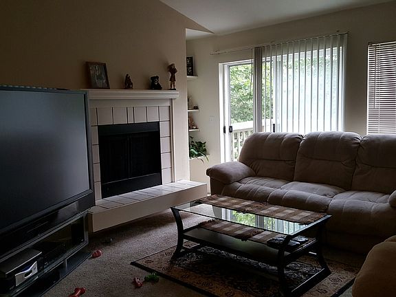 Living Room with fireplace and Balcony