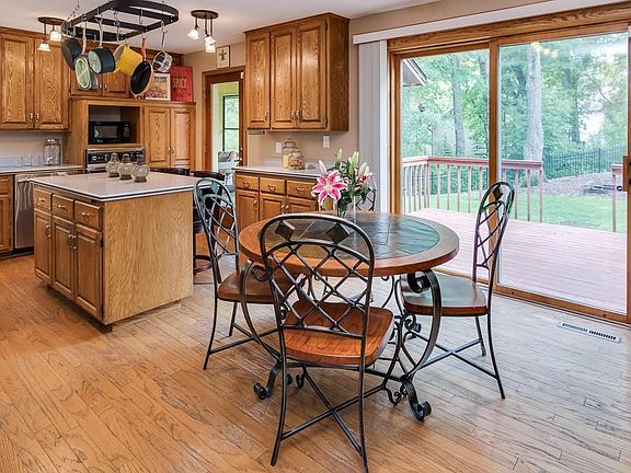 The heart of this home with natural light, informal eating area, plenty of counter space and access to the deck