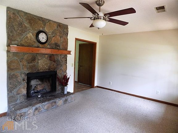 The stone fireplace is the focal point of the living room.