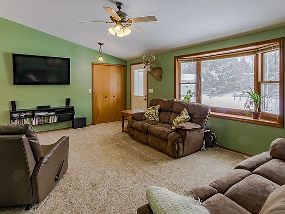 Living room with cathedral ceilings.