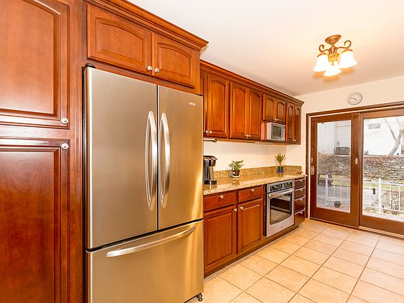 Kitchen was beautifully renovated in 2013. High end stainless steel appliances, granite counter tops, attractive wood cabinets provide tons of storage.