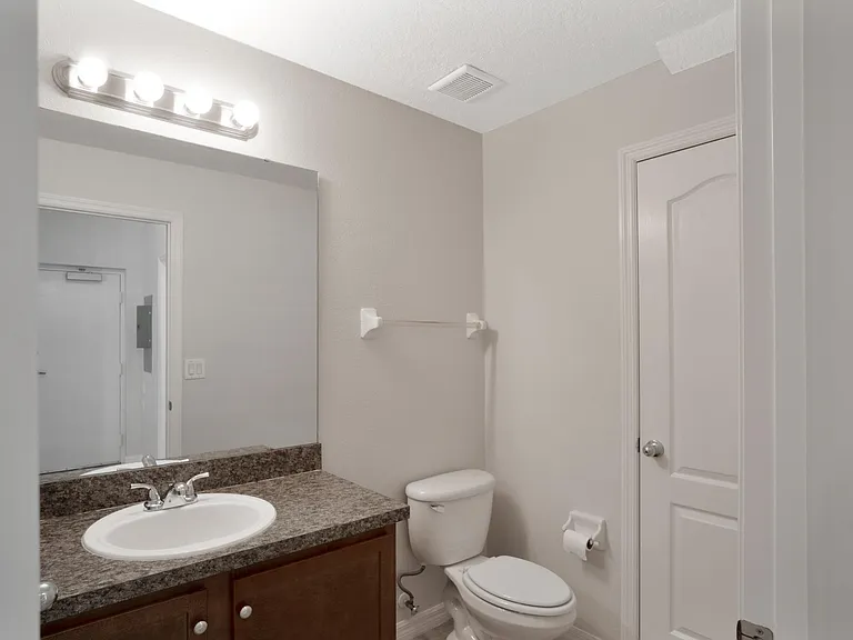 Downstairs half bath with storage closet