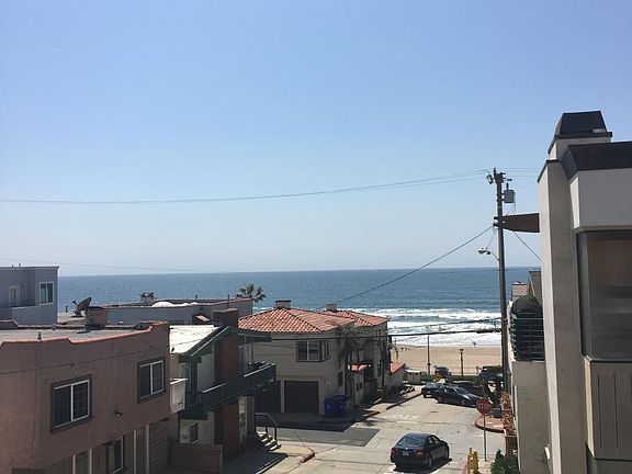 standing on balconey outside of living room