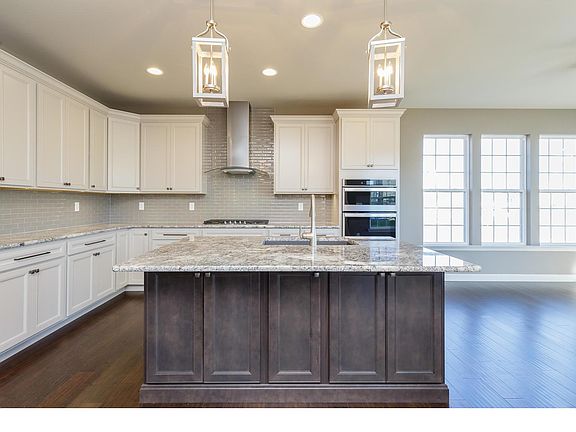 Kitchen with breakfast bar, stainless appliances and granite counter tops