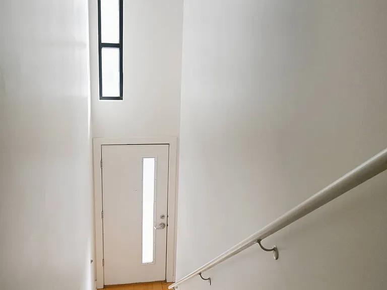 Staircase in a townhome with natural lighting at The Sawyer.