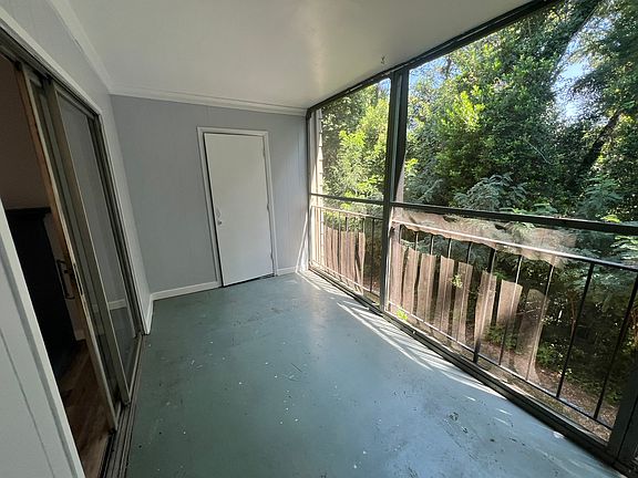 The balcony with a screened in porch