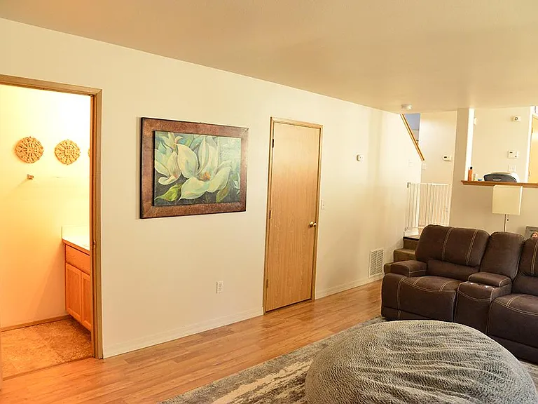 half bath on left with door to laundry room on right. Laundry is a pass through to separate garage door