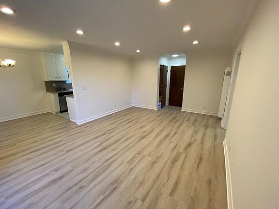 View with back to balcony. Entrance door; closet; kitchen and breakfast nook to the left