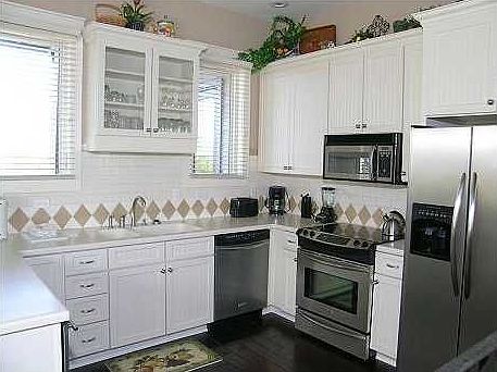 Bright Kitchen with Stainless Steel Appliances