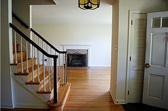Living room w/ brick fireplace on the right