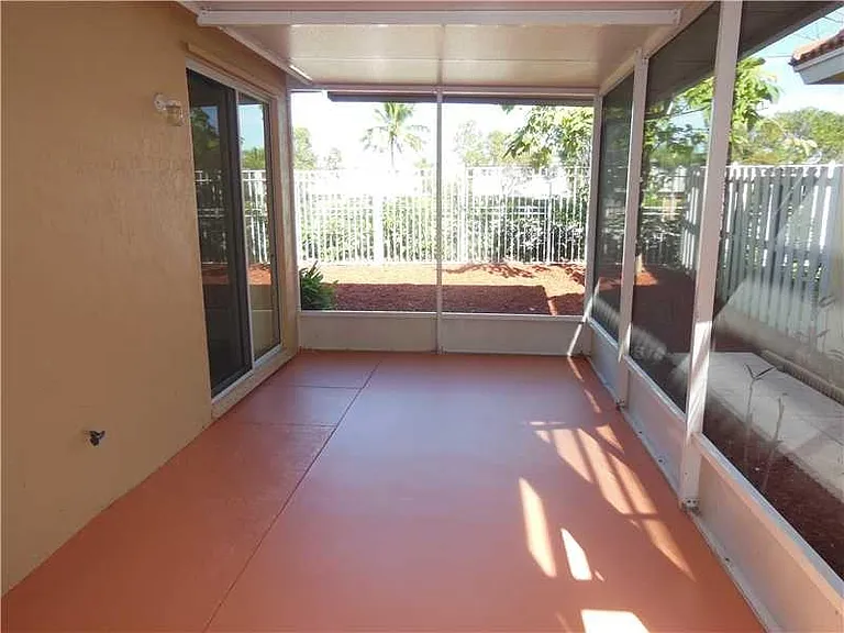 Screened backyard porch.