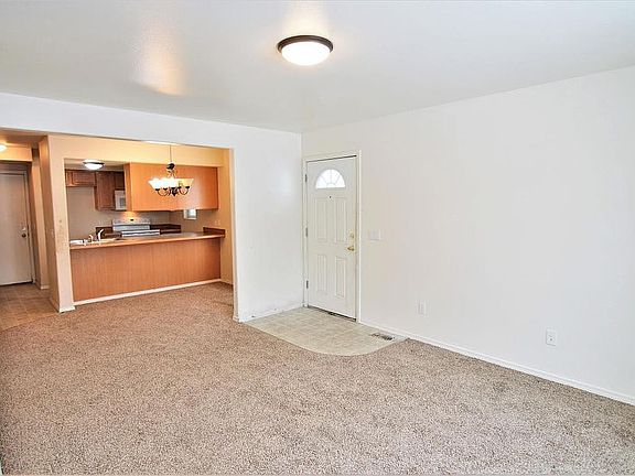 Living room opens to dining
