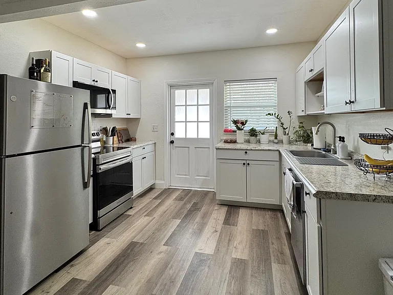 Kitchen with stainless steel appliances, including dishwasher