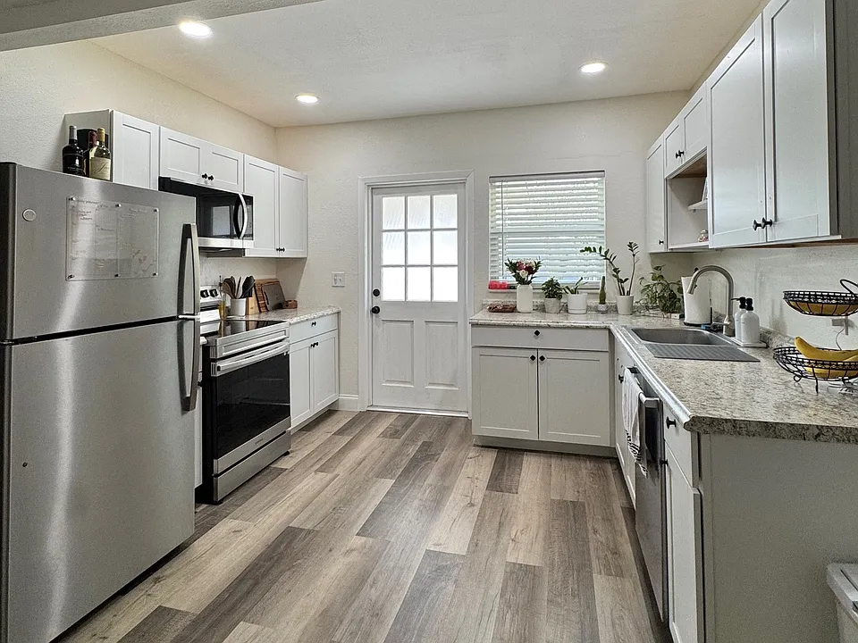 Kitchen with stainless steel appliances, including dishwasher