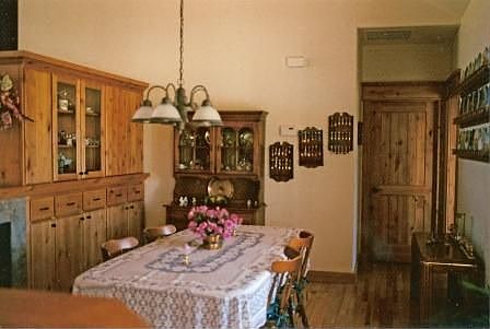 Formal dining room, custom alder wood cabinets and laundry room in back