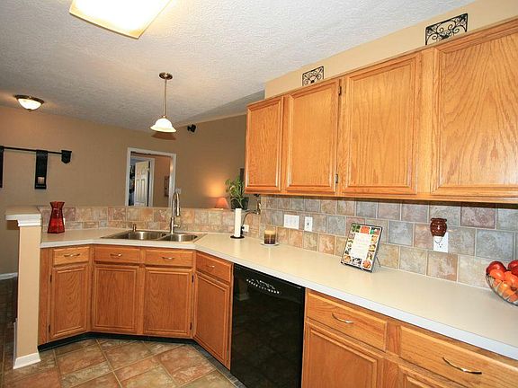 THE KITCHEN PROVIDES COUNTERSPACE & CABINETS GALORE.