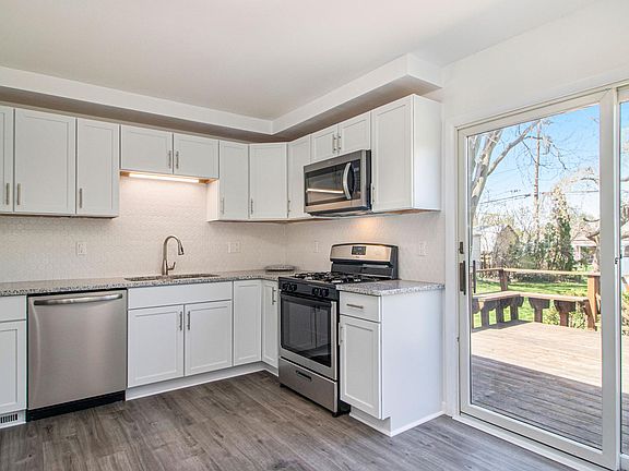 All brand new stainless steel appliances, gas stove, kitchen cabinets, quartz countertops, and luxury vinyl plank flooring