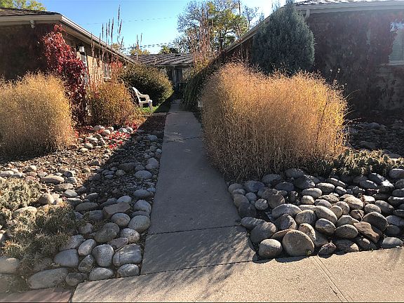 This photo was taken in winter_summer foliage is lush and green. Many flowers and bushes. Private!