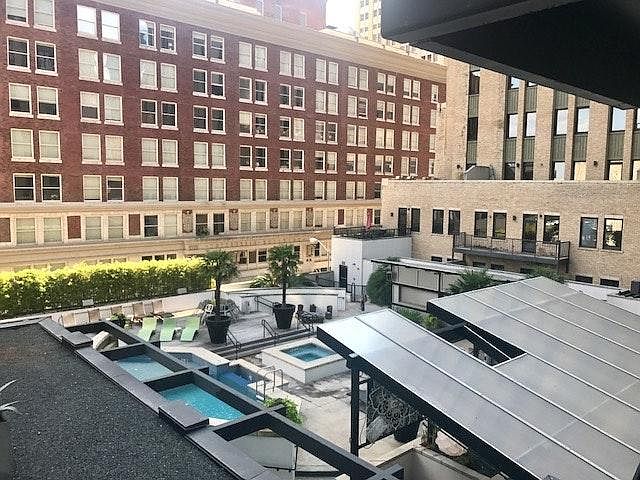 View from Juliet balcony of pool and deck area