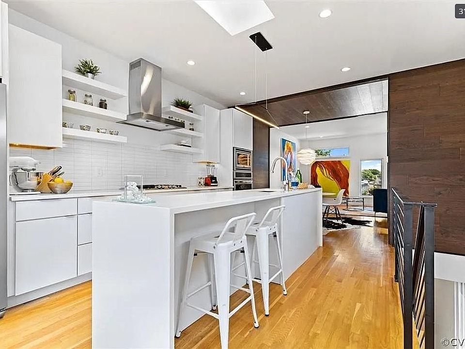 Bright and airy Chef's kitchen, dining room and living room.