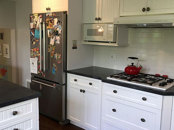 Kitchen opens to living & dining rooms as well as to the put