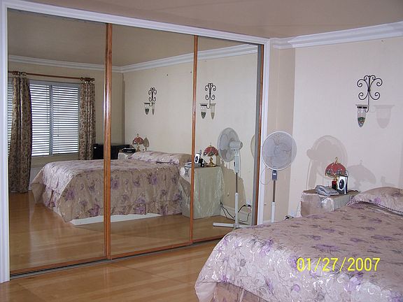 This large Master has hrdwd floors, smooth ceilings, mirrored wardrobe, + 