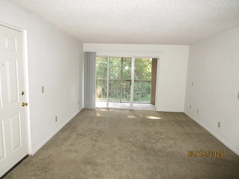 LOOKING FROM DINING AREA TO PATIO