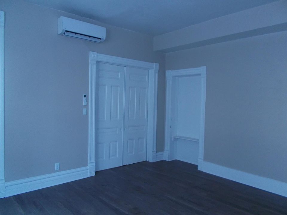 Living/dining with pocket doors into the bedroom.
