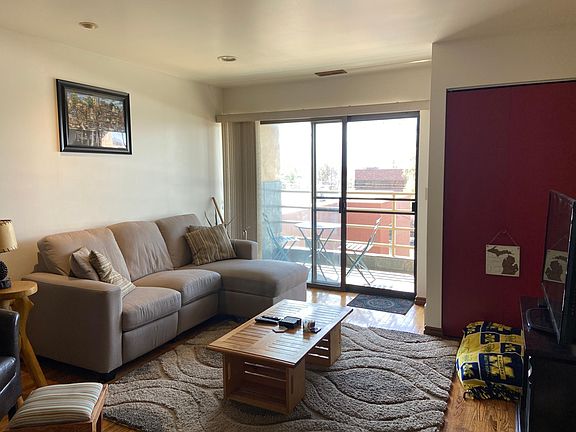 Living room with balcony and lots of natural light