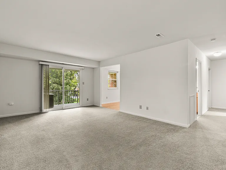 Spacious living room features sliding glass doors that lead to your private patio or balcony (3-bedroom floor plan shown)