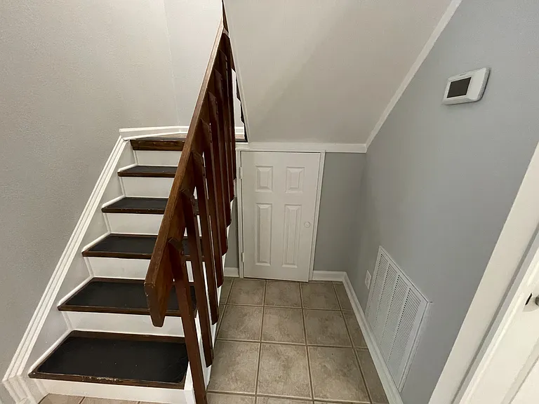No space is wasted in this unit - under stairs AND under stair landing storage. Programmable WIFI thermostat.
