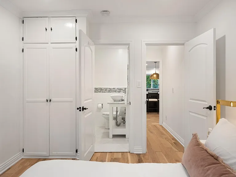 Discover an intimate escape in this ensuite bedroom, where luxury and comfort seamlessly intertwine.
