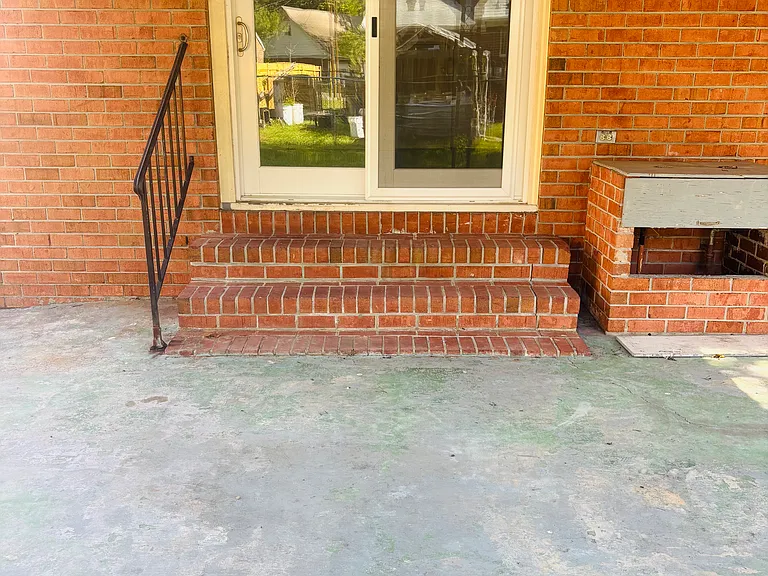 Dining area, Kitchen in background, and back exit to patio