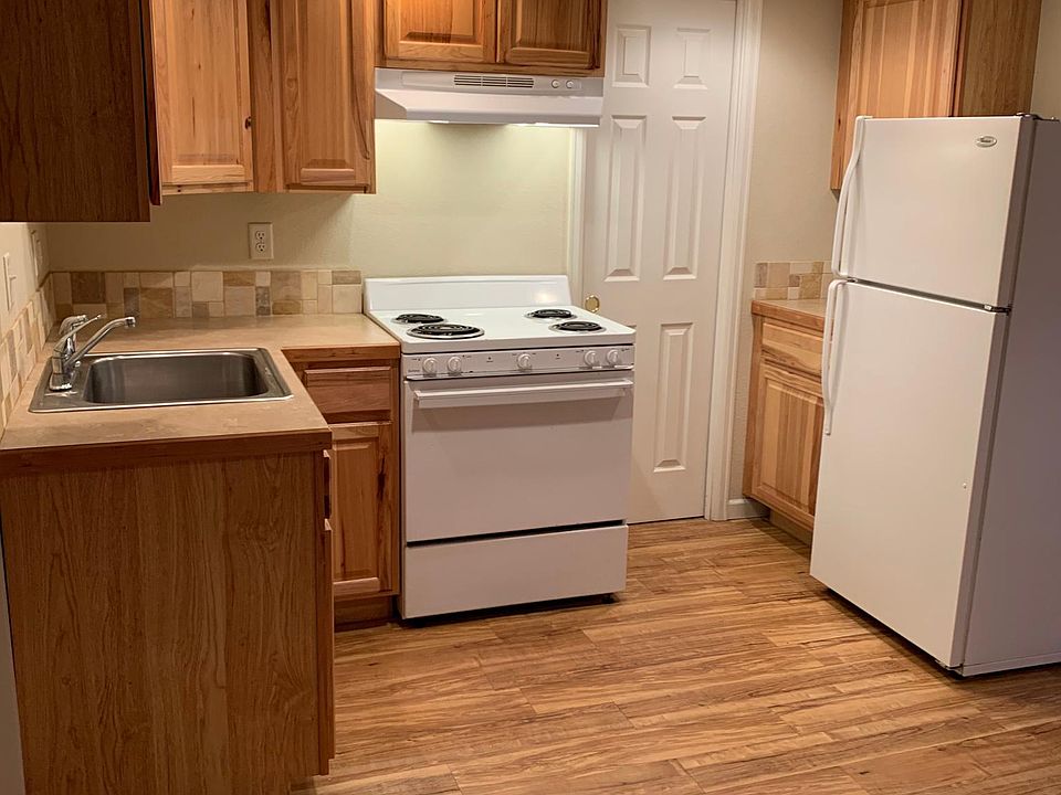 Hickory cabinets, electric range/oven, refrigerator, sink, garbage disposal