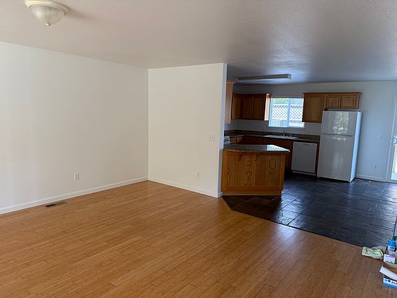 Bamboo hardwood in living, slate tile in kitchen