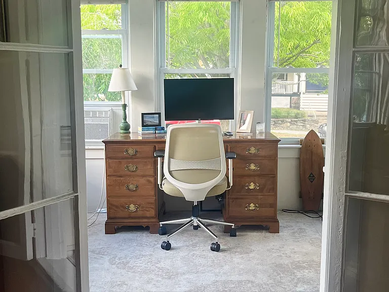 *Furnished photo for advertising only. Looking from the living out to the front 3-season sunroom/entryway (faces Broadway).