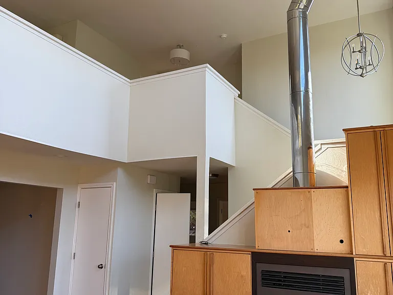Living Room Looking up into loft and upstairs