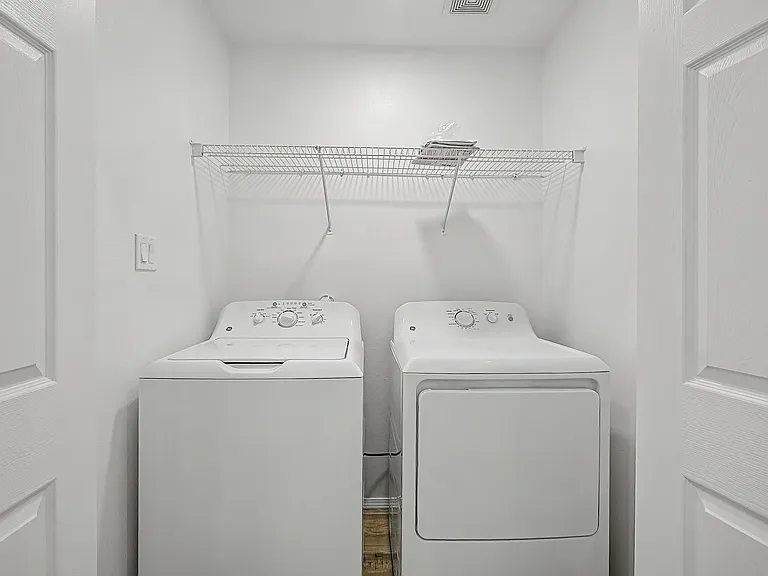 Laundry with washer and dryer.