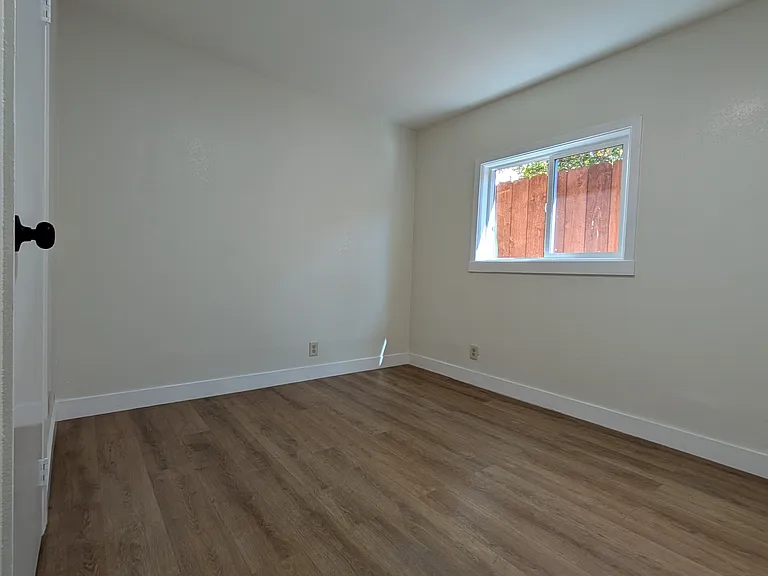 Bedroom two. With closet. Not staged. Large window