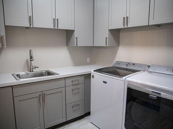 Laundry room with tons of storage.