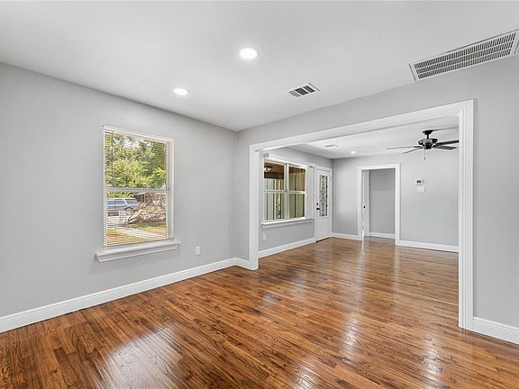 Spare room featuring wood-type flooring, recessed lighting, and ceiling fan