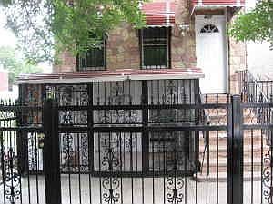 Front of the house with new gates and fence