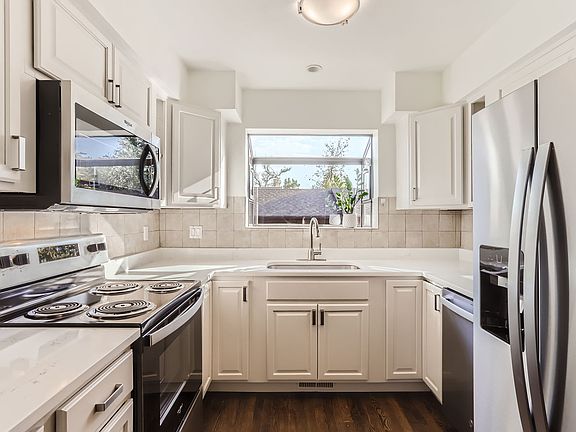 Brand new appliances, counters and garden window.