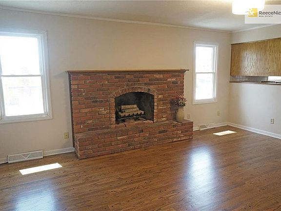 LIVING ROOM WITH BRICK FIREPLACE