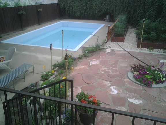 Our backyard: filling up the pool summer 2007.