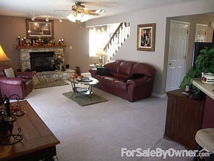Living Room with stone fireplace : New Carpet on first floor, french doors to outside deck